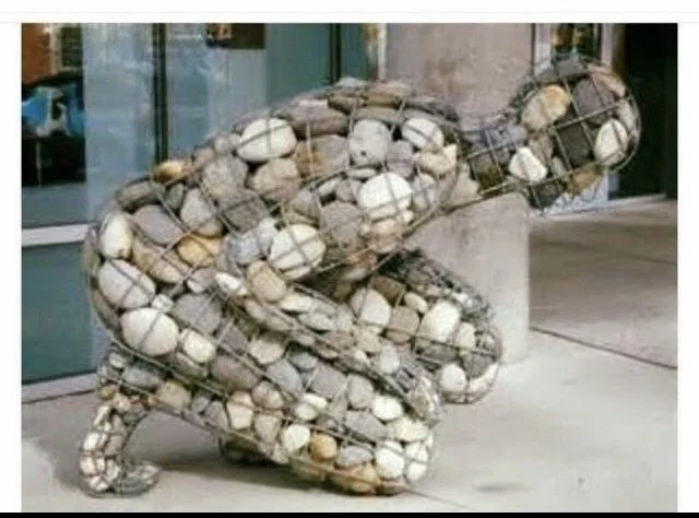 Stone and wire figure sculpture for reflection on lament